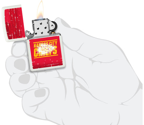 NFL Draft Kansas City Chiefs Windproof Lighter lit in hand.