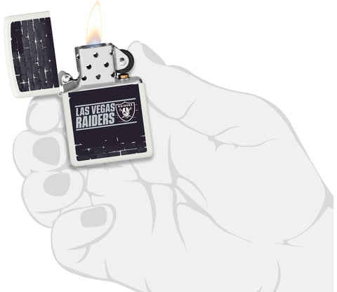 NFL Draft Las Vegas Raiders Windproof Lighter lit in hand.