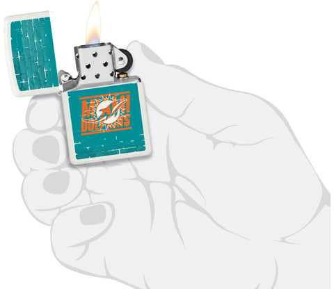 NFL Draft Miami Dolphins Windproof Lighter lit in hand.