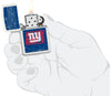 NFL Draft New York Giants Windproof Lighter lit in hand.