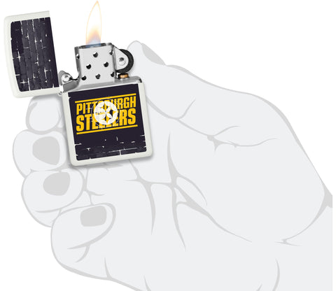 NFL Draft Pittsburgh Steelers Windproof Lighter lit in hand.