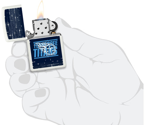 NFL Draft Tennessee Titans Windproof Lighter lit in hand.