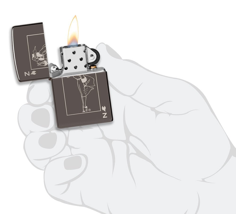 Windy Design Card Black IceÂ® Windproof Lighter lit in hand.
