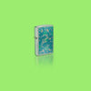 Glamour shot of Zippo John Smith Gumbula Snake & Turple Design Street Chrome Windproof Lighter standing in a green scene.