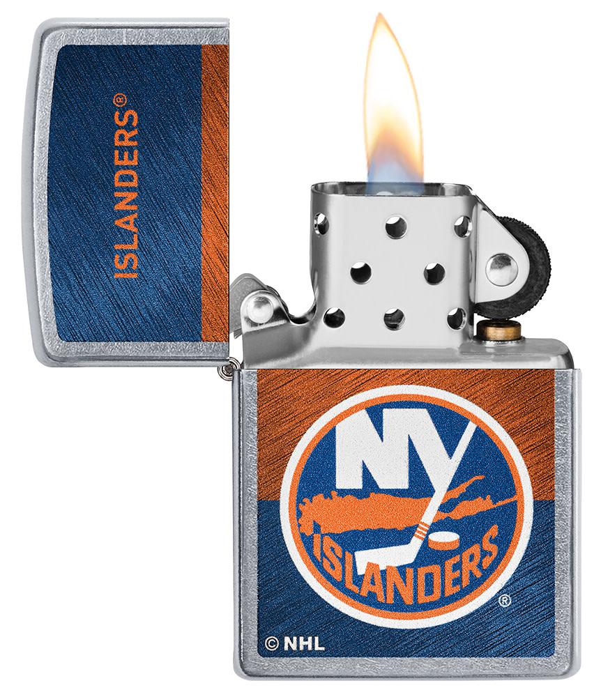 NHL® New York Islanders Street Chrome™ Windproof Lighter with its lid open and lit