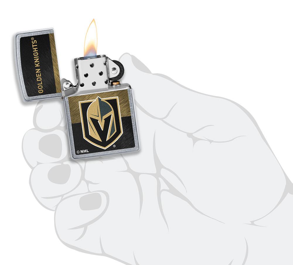 NHL® Vegas Golden Knights Street Chrome™ Windproof Lighter lit in hand