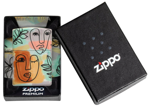 Angled shot of Abstract Faces Design 540 Color Windproof Lighter, showing the front and right side of the lighter.
