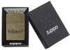 Zippo Stamp Antique Brass Lighter in its packaging.