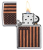 WOODCHUCK USA American Flag Windproof Lighter with its lid open and lit
