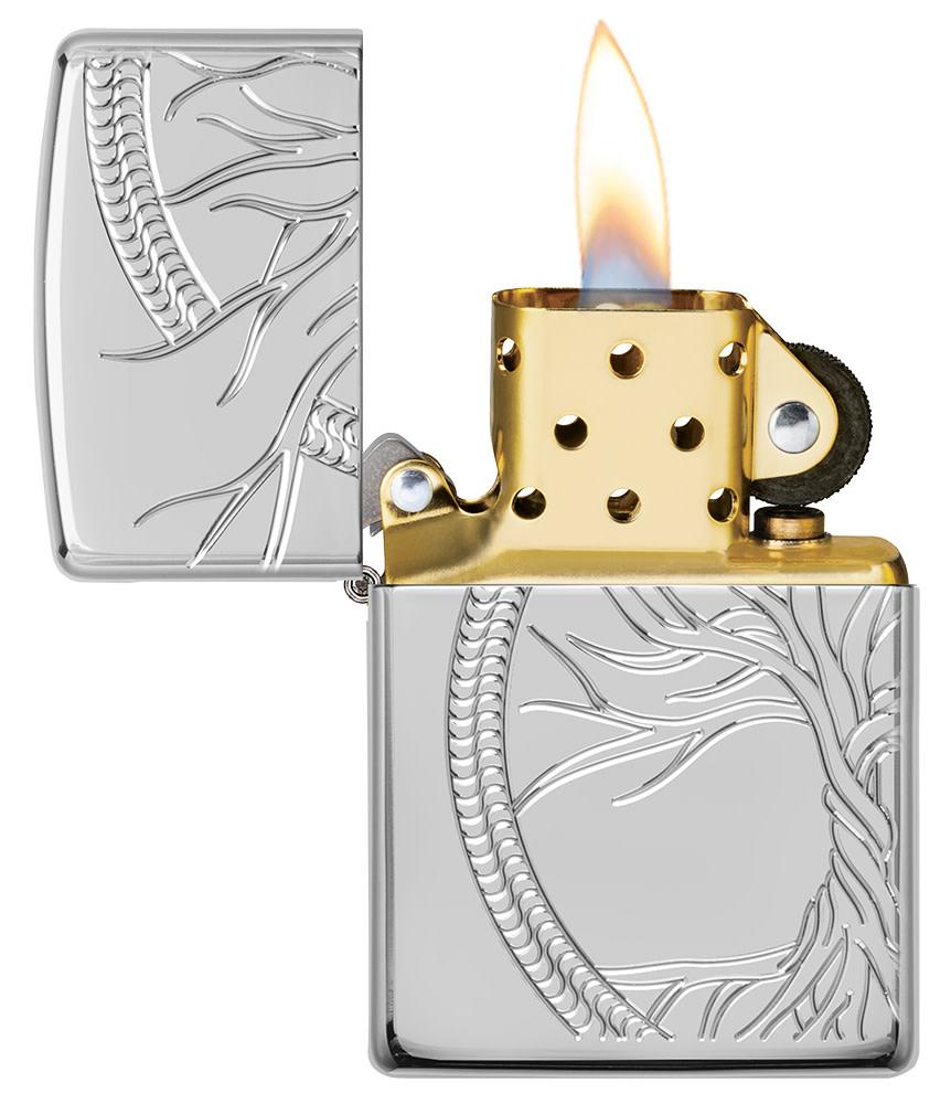 ArmorÂ® High Polish Sterling Silver Tree of Life Windproof Lighter with its lid open and lit