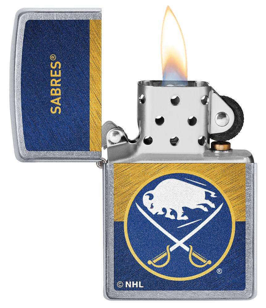 NHL® Buffalo Sabre Street Chrome™ Windproof Lighter with its lid open and lit