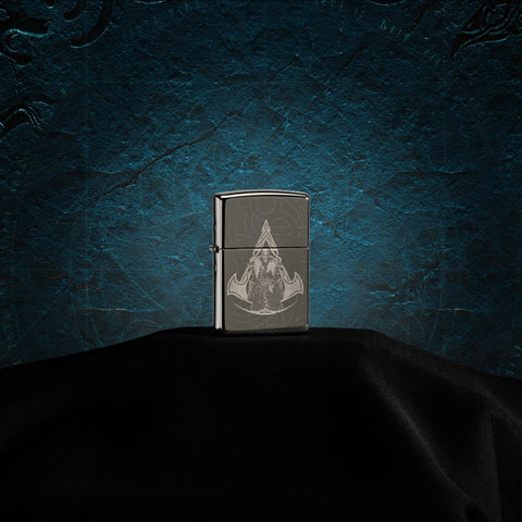Assassin's Creed® Valhalla pocket lighter closed showing the front of the lighter at a 3/4 angle in front of a blue background