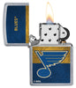NHL® St Louis Blues Street Chrome™ Windproof Lighter with its lid open and lit