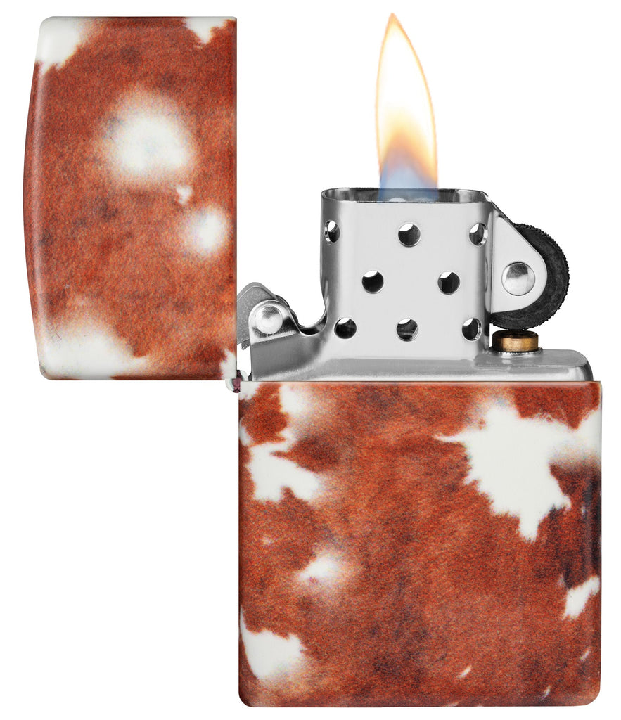 Cow Print Design 540 Color Windproof Lighter with its lid open and lit.