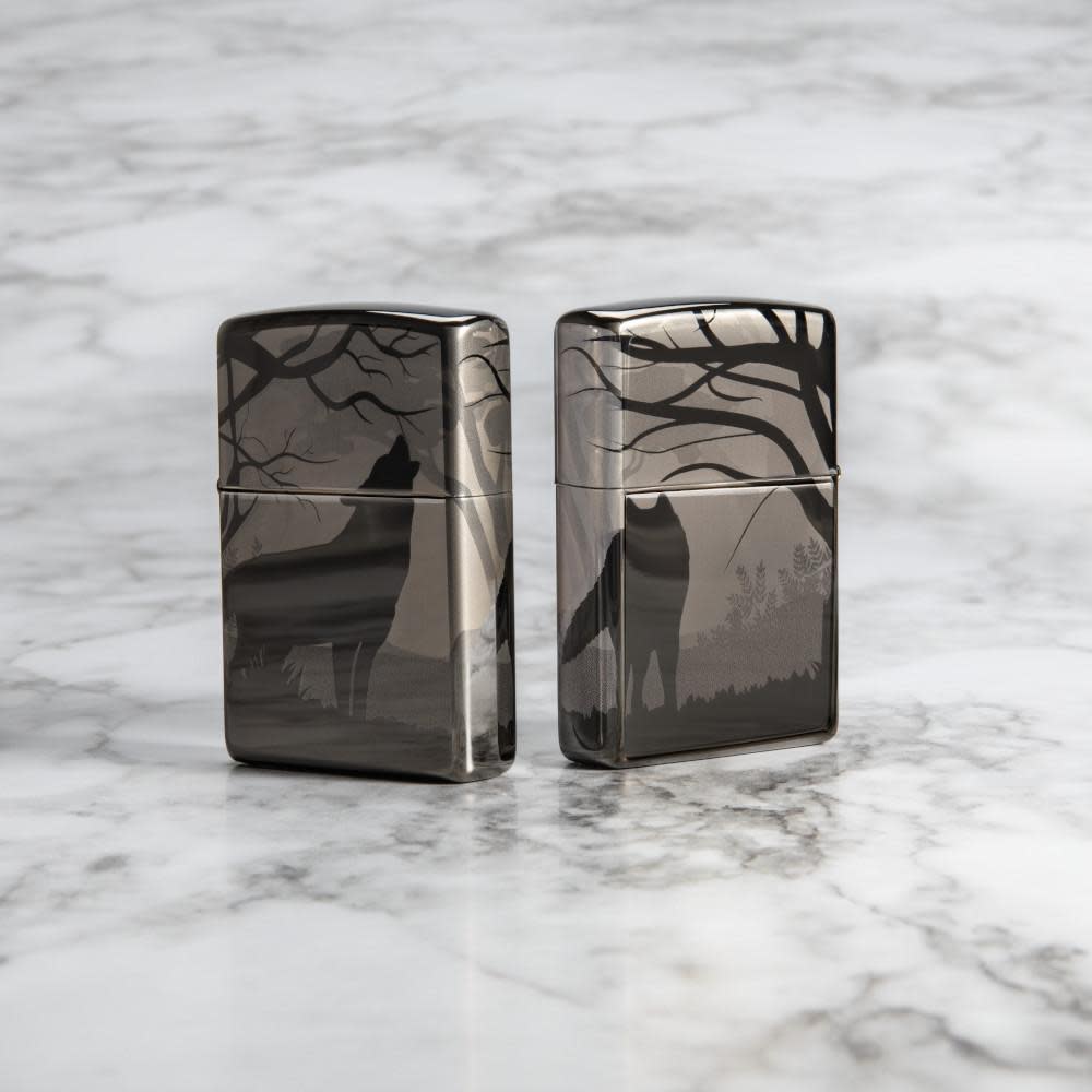 Lifestyle image of Wolves Design Photo Image 360Â° Black Ice Windproof Lighter standing on a marble surface