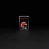 Lifestyle image of NFL Cincinnati Bengals Helmet Street Chrome Windproof Lighter standing in a black background.