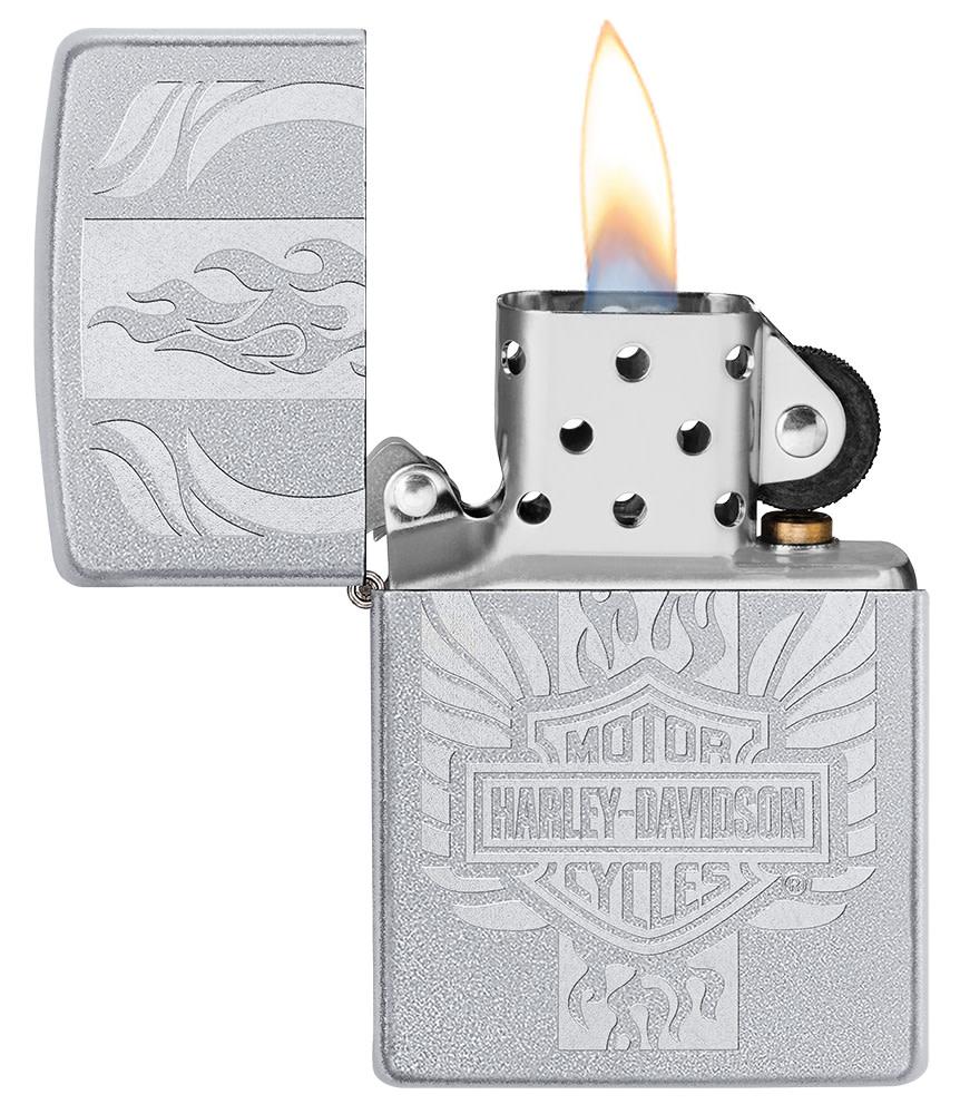 Harley-Davidson® Luster Etch Satin Chrome Windproof Lighter with its lid open and lit.