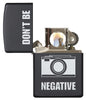 Front view of the Don't Be Negative Black Matte Windproof Lighter open and lit