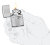 NFL New England Patriots Deep Carve Collectible Windproof Lighter lit in hand