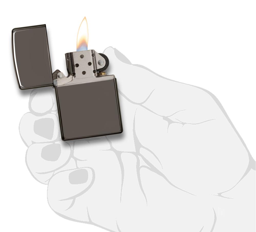 Black IceÂ® Windproof Lighter lit in hand