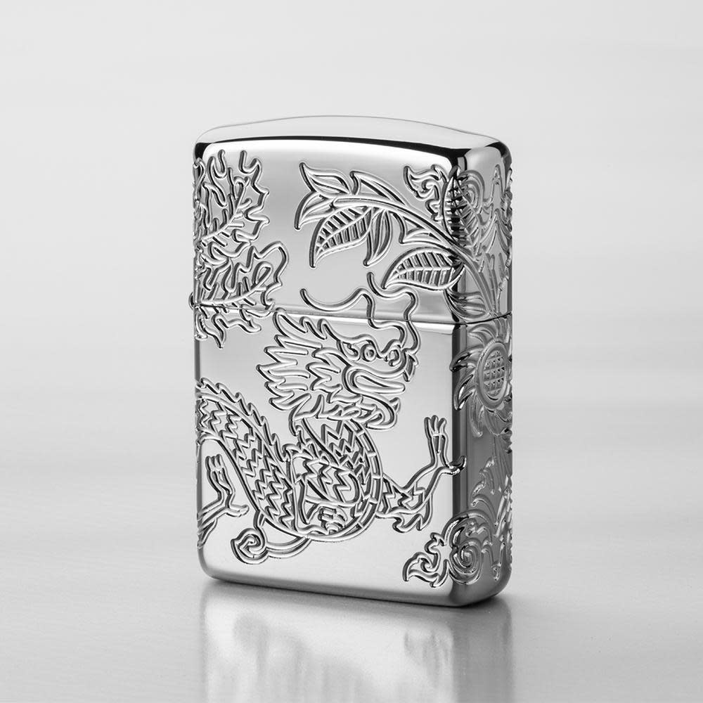 Lifestyle image of ArmorÂ® Dragon and Phoenix Design Windproof Lighter with a grey background