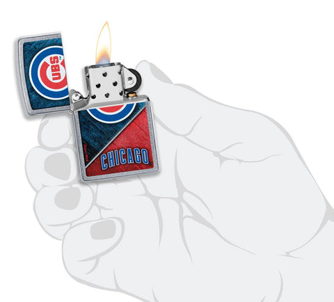 MLB™ Chicago Cubs™ Street Chrome™ Windproof Lighter lit in hand.
