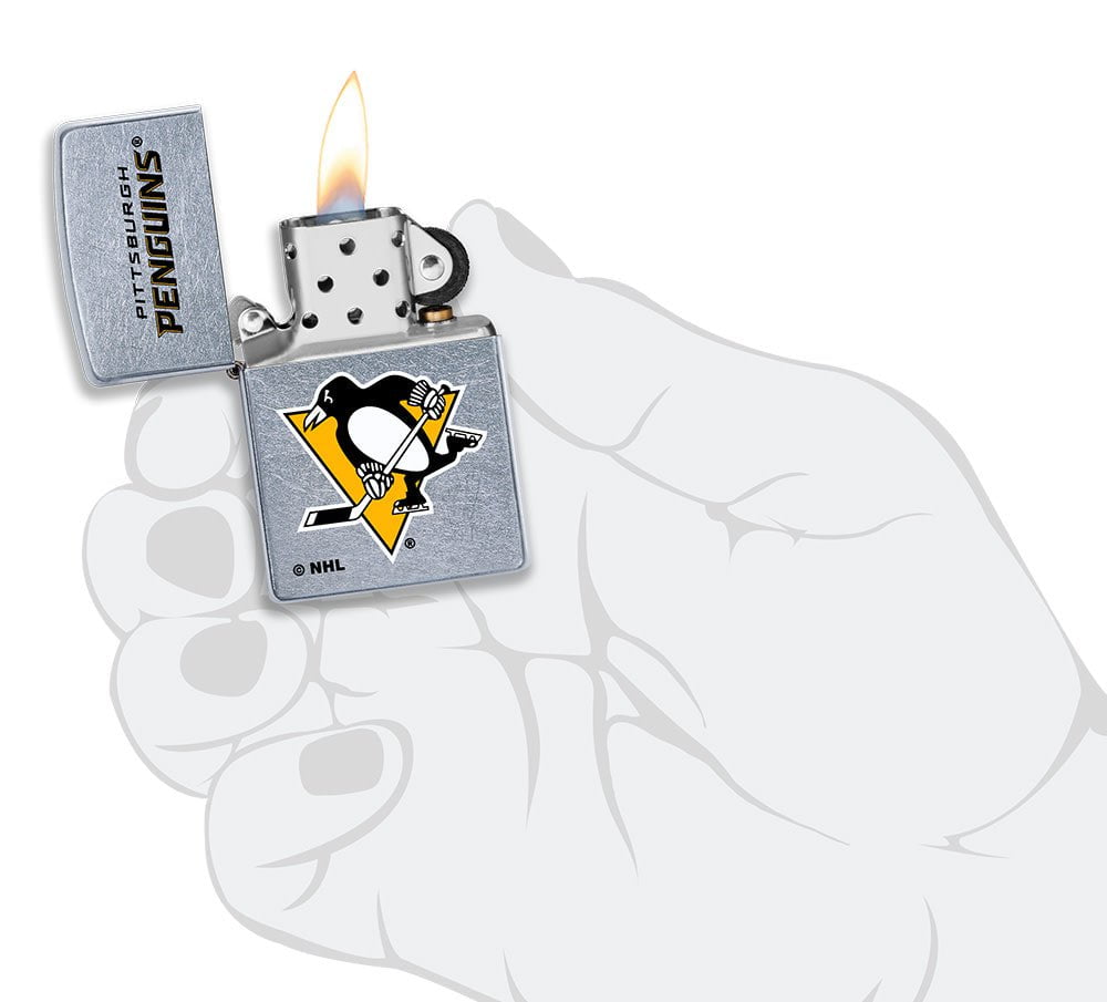 NHL Pittsburgh Penguins Street Chrome™ Windproof Lighter lit in hand