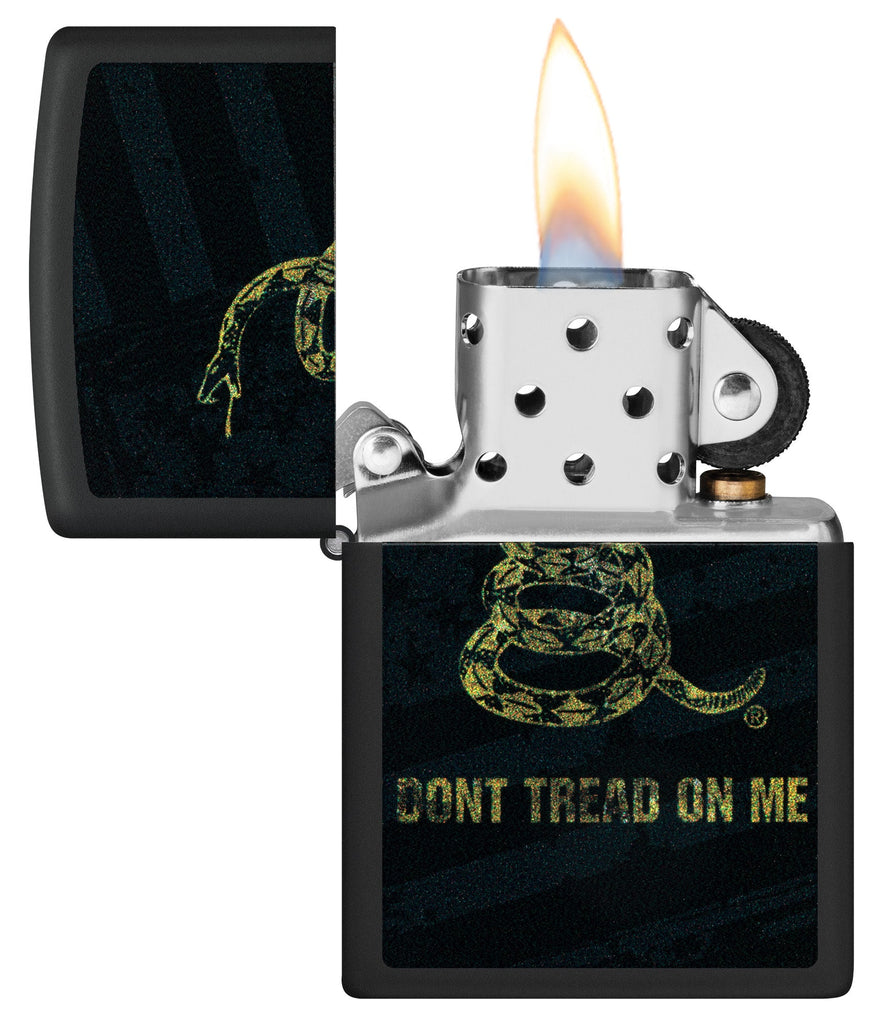 Zippo Don't Tread On Me Snake and Flag Black Matte Windproof Lighter with its lid open and lit.