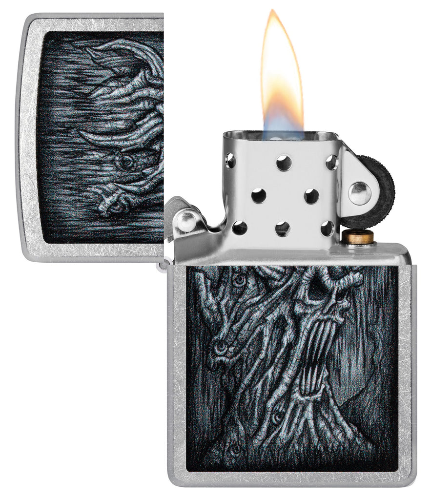Zippo Evil Tree Design Street Chrome Windproof Lighter with its lid open and lit.