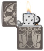 Day of the Dead Skull Cross Design Black Ice Windproof Lighter with its lid open and lit.