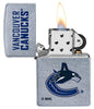 NHL Vancouver Canucks Street Chrome™ Windproof Lighter with its lid open and lit