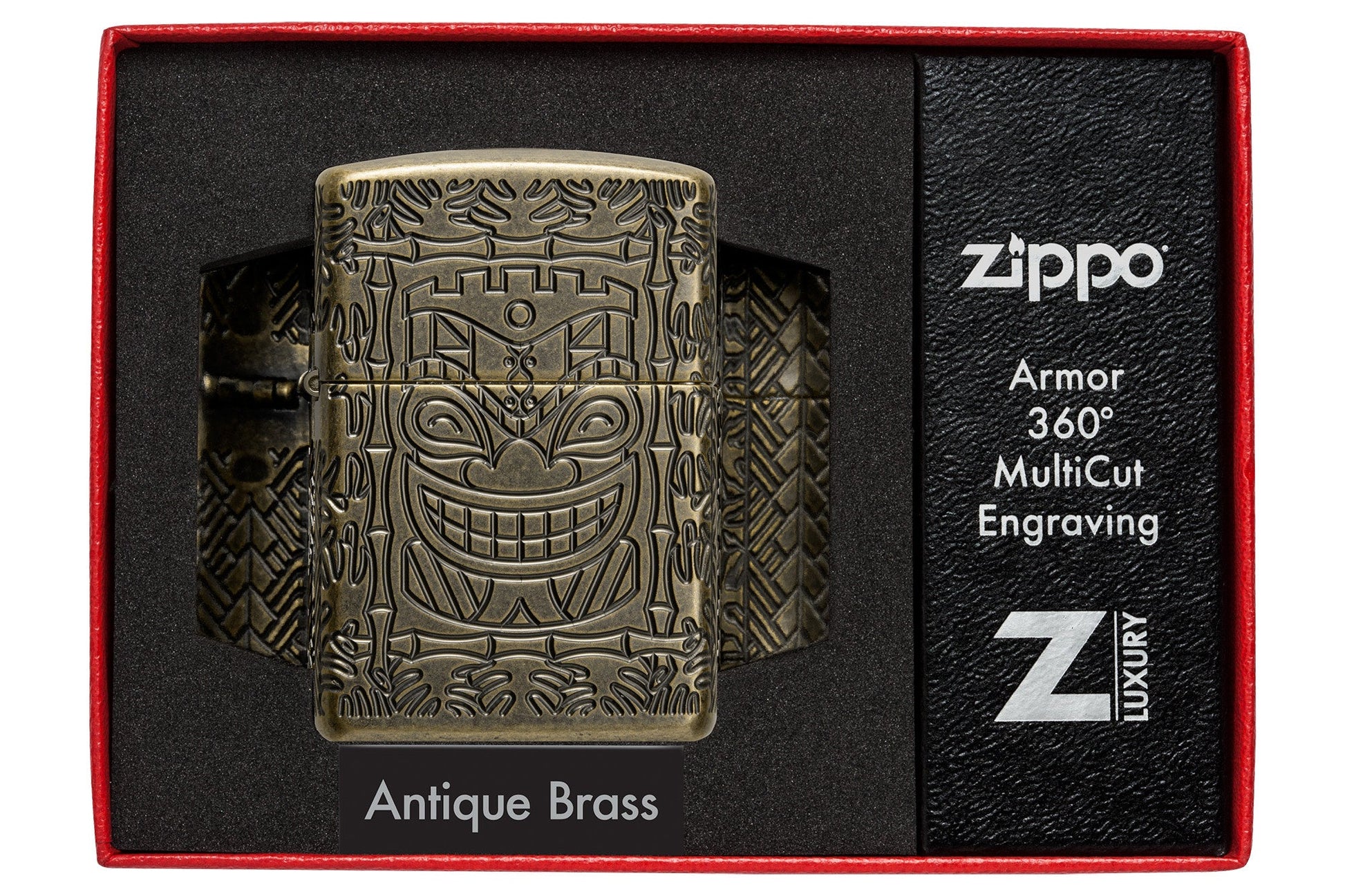 Tiki Design ArmorÂ® Antique Brass Windproof Lighter in it's packaging.