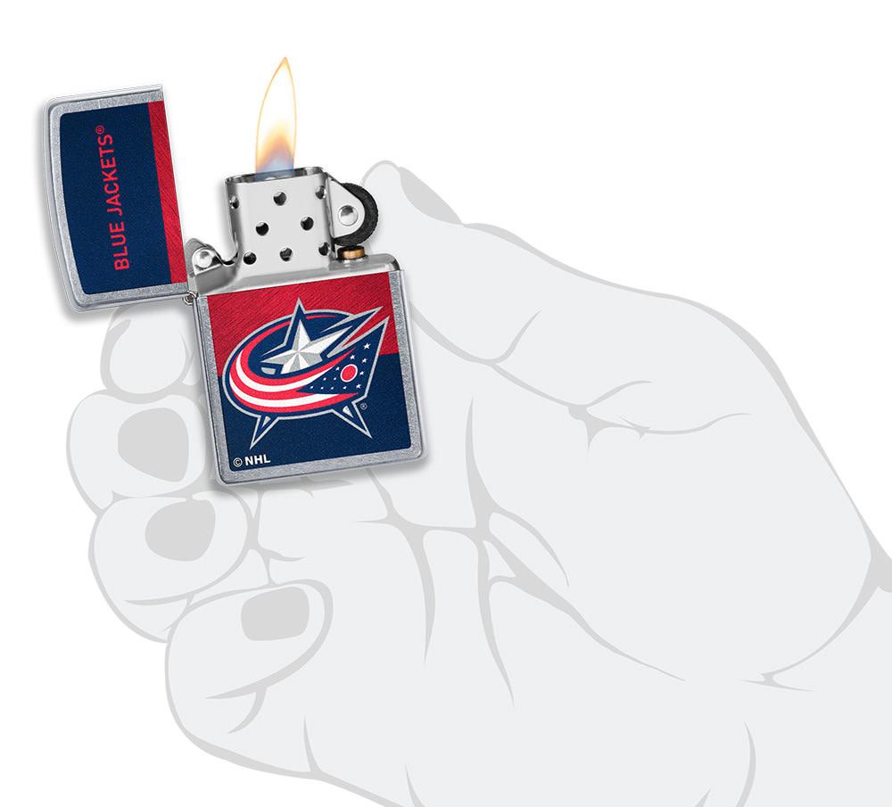 NHL® Colorado Avalanche Street Chrome™ Windproof Lighter lit in hand