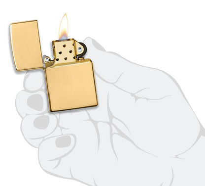 ArmorÂ® High Polish 18K Solid Gold Windproof Lighter lit in hand.