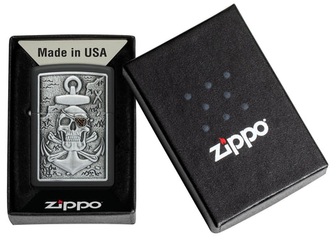 Skull Anchor Emblem Design Black Matte Windproof Lighter in it's packaging.