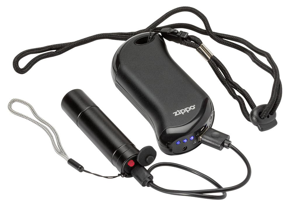 Image of Flashlight plugged in and charging by the Black HeatBankâ„¢ 9s Rechargeable Hand Warmer via included USB charging cable.