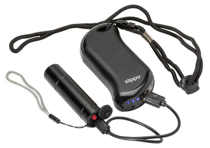 Image of Flashlight plugged in and charging by the Black HeatBankâ„¢ 9s Rechargeable Hand Warmer via included USB charging cable.