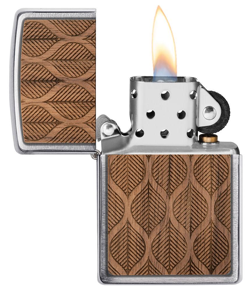 WOODCHUCK USA Walnut Leaves Two-Sided Emblem Windproof Lighter with its lid open and lit.