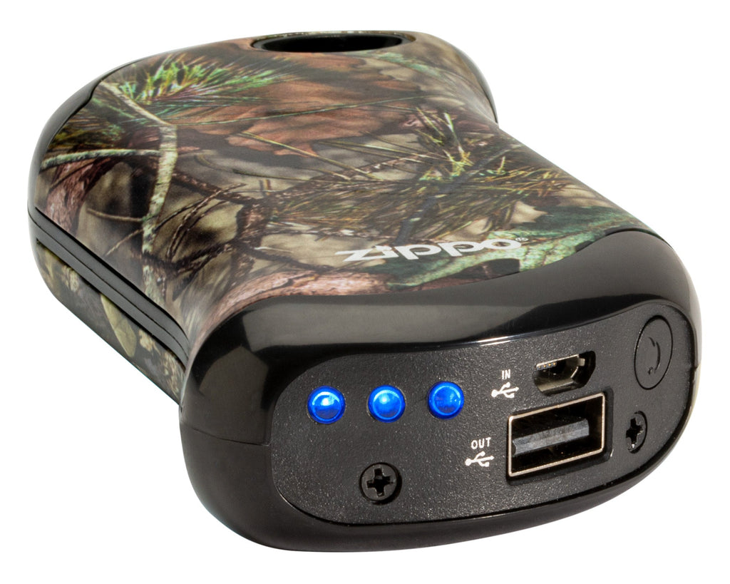 Mossy Oak® Break-Up Country® HeatBank 9s Rechargeable Hand Warmer laying down, showing the USB plug and power button.