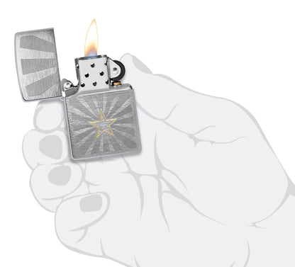 Zippo Star Design Brushed Chrome Windproof Lighter lit in hand.