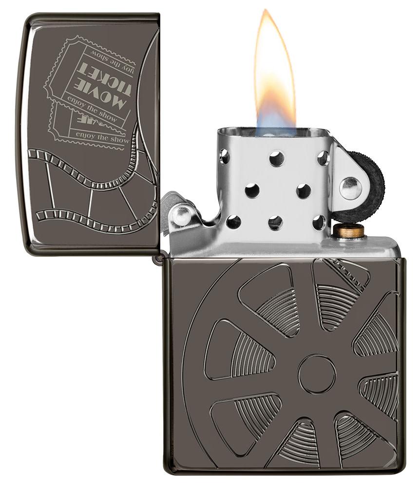 Celebrating Movies ArmorÂ® Black IceÂ® Windproof Lighter with its lid open and lit.