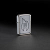 Lifestyle image of Zippo Logo Flame Design 1941 Replica Brushed Chrome Windproof Lighter standing in a black background.