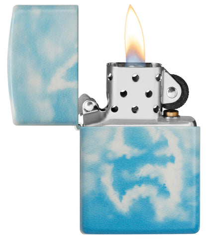 Cloudy Sky Design 540 Color Windproof Lighter lit in hand.