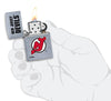 NHL New Jersey Devils Street Chrome™ Windproof Lighter lit in hand