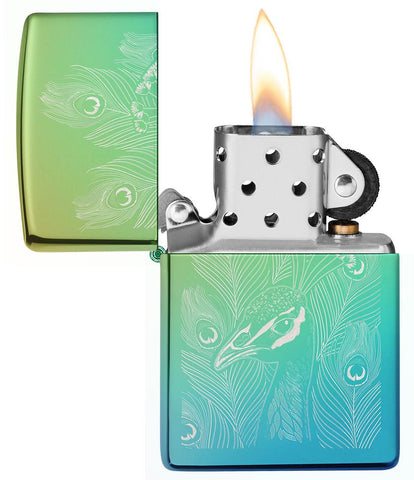 Peacock Design High Polish Teal Windproof Lighter with its lid open and lit