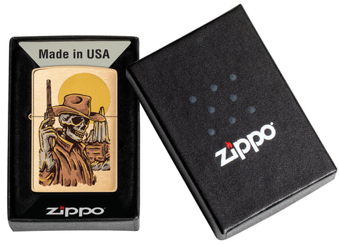Zippo Wild West Skeleton Design Brushed Brass Windproof Lighter in its packaging.