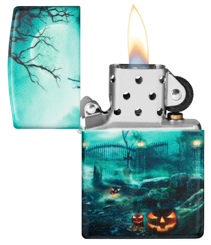 Zippo Graveyard Design 540 Color Windproof Lighter with its lid open and lit.