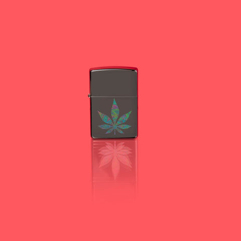Glamour shot of Zippo Funky Cannabis Design Black Ice Windproof Lighter standing in a red scene.