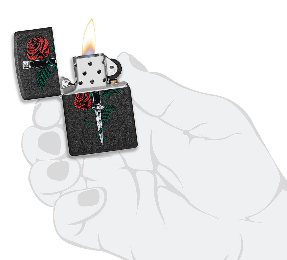 Rose Dagger Tattoo Design Black CrackleÂ® Windproof Lighter lit in hand.