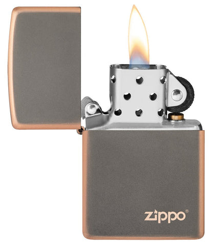 Classic Rustic Bronze Zippo Logo Windproof Lighter with its lid open and lit.